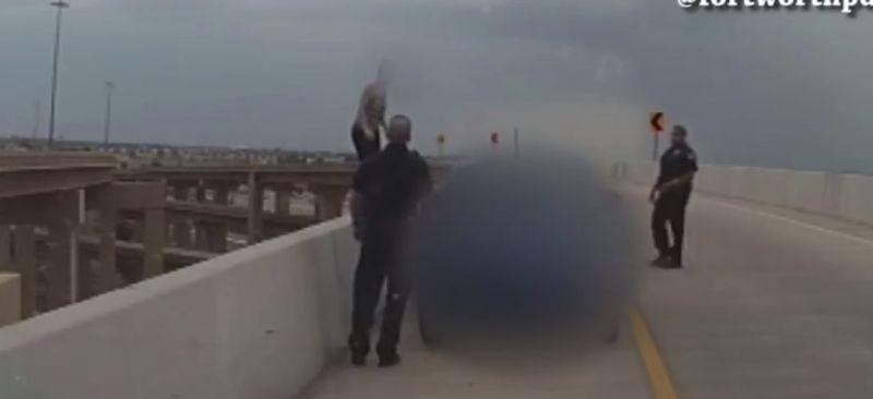 Fort Worth police released a video of officers rescuing a suicidal woman who was standing precariously close to the edge of an overpass. (Fort Worth Police)