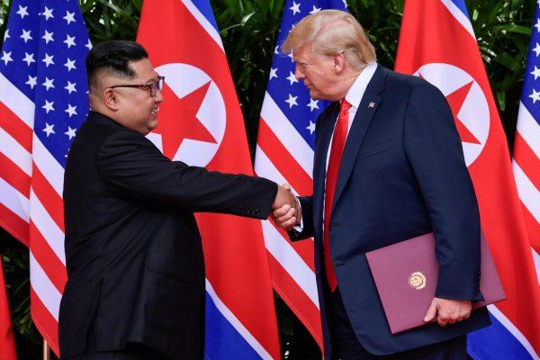 Trump and Kim shake hands at Singapore summit