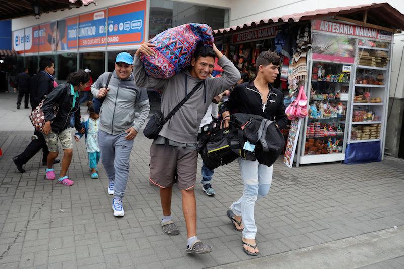 Venezuelan migrants arrive from Cucuta of Colombia, during a five day trip, at the bus terminal in Lima, Peru August 24, 2018. (Reuters/Guadalupe Pardo)
