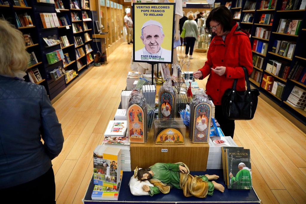  Pope Francis related items are displayed for sale inside the Veritas religious bookshop in Dublin, Ireland, Friday, Aug. 24, 2018. Pope Francis arrives on Saturday for a two-day visit to Ireland. (AP/Matt Dunham)