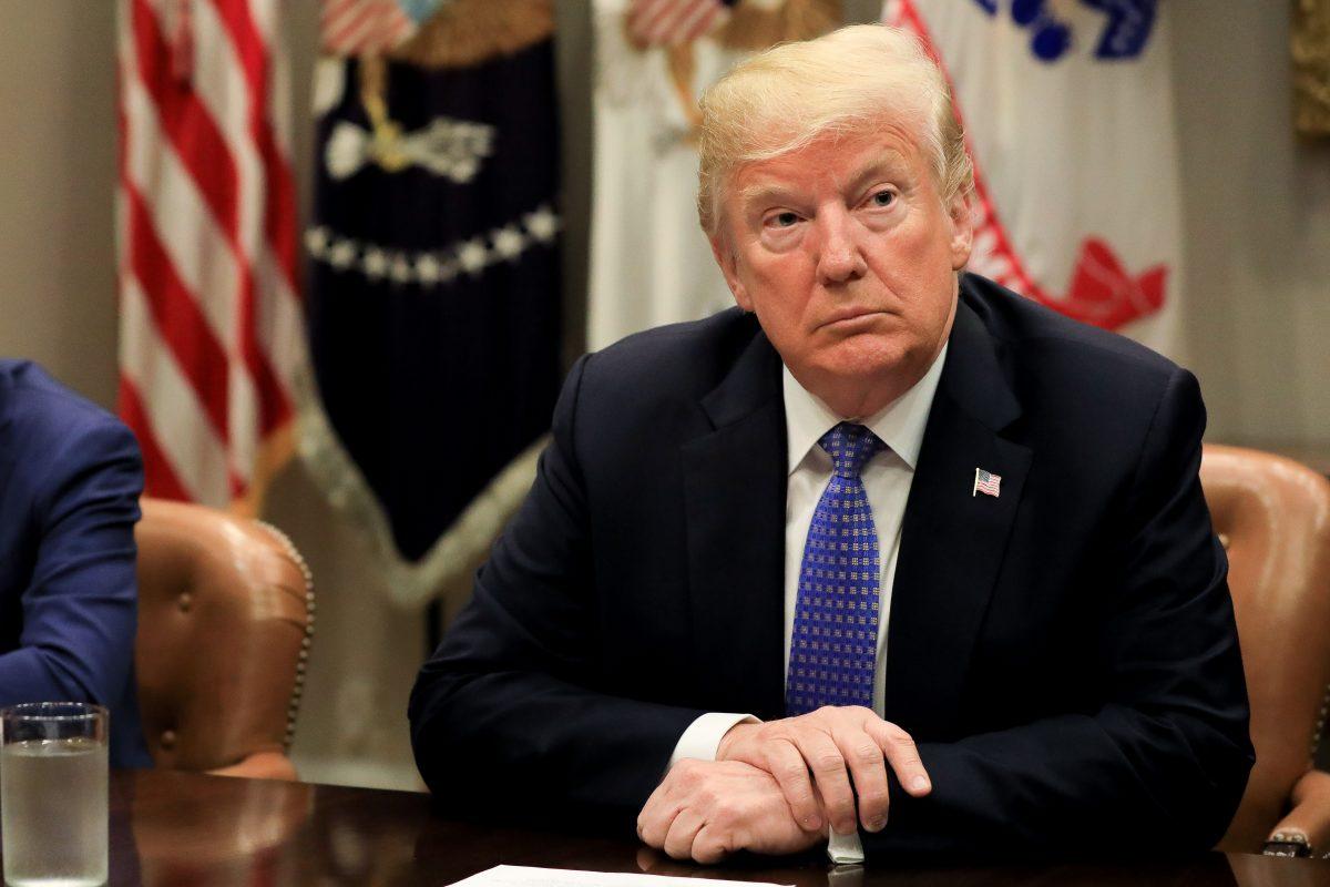 President Donald Trump participates in a roundtable on the Foreign Investment Risk Review Modernization Act at the White House on Aug. 23, 2018. (Samira Bouaou/The Epoch Times)