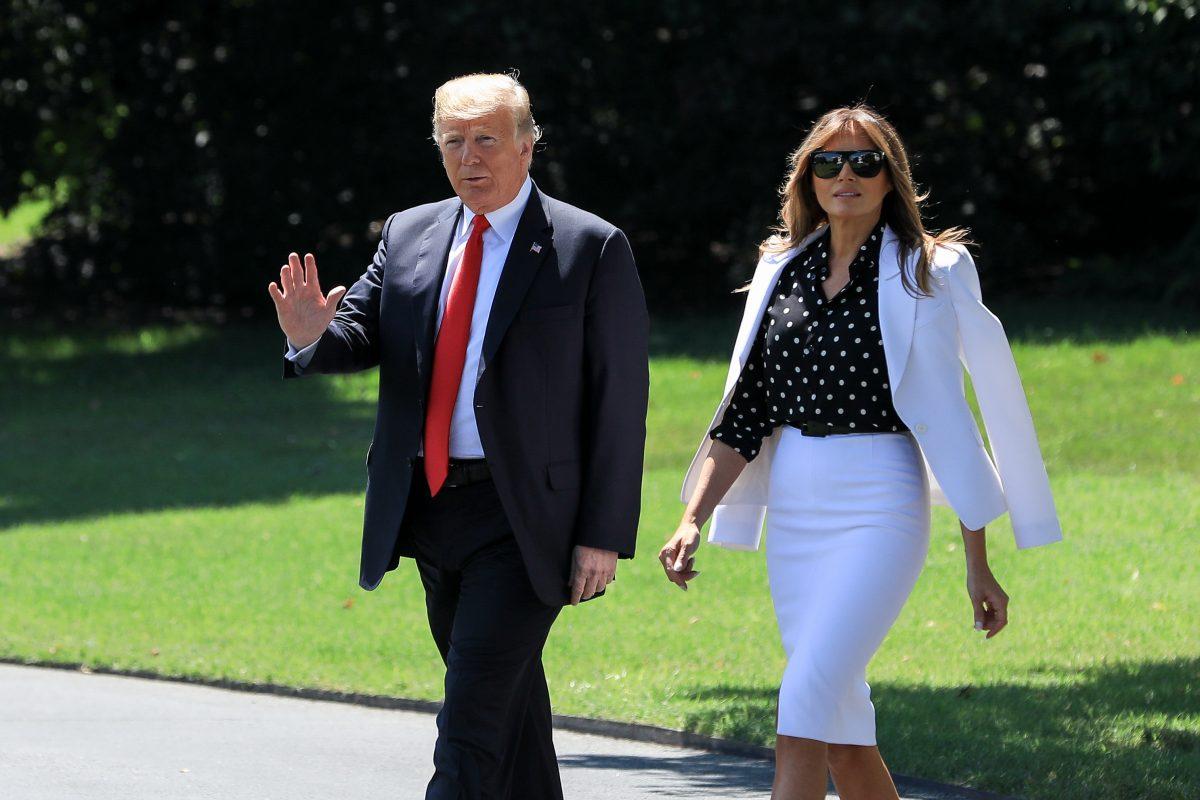 President Donald Trump and First Lady Melania Trump walk across the White House South Lawn to board Marine One en route to Columbus, Ohio, on Aug. 24, 2018. (Samira Bouaou/The Epoch Times)