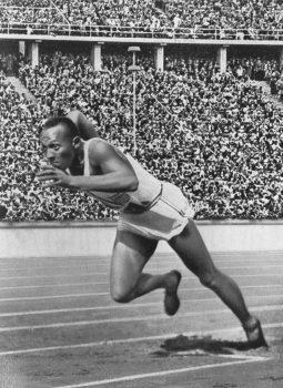 Superman’s speed may have been modeled after Jesse Owens, here at the 1936 Berlin Olympic games. (Public Domain)
