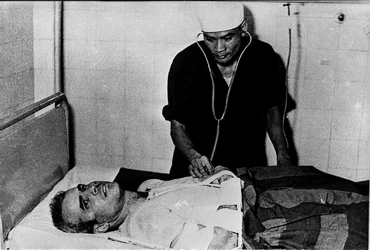 U.S. Navy pilot John McCain being examined in 1967. McCain was captured in 1967 at a lake in Hanoi after his warplane was downed by a North Vietnamese missile during the Vietnam War. (AFP/Getty Images)