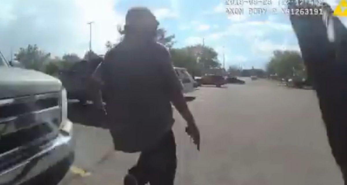 Police body camera footage shows an alleged shoplifting suspect firing shots at a police officer in a Walmart parking lot. (Albuquerque Police)