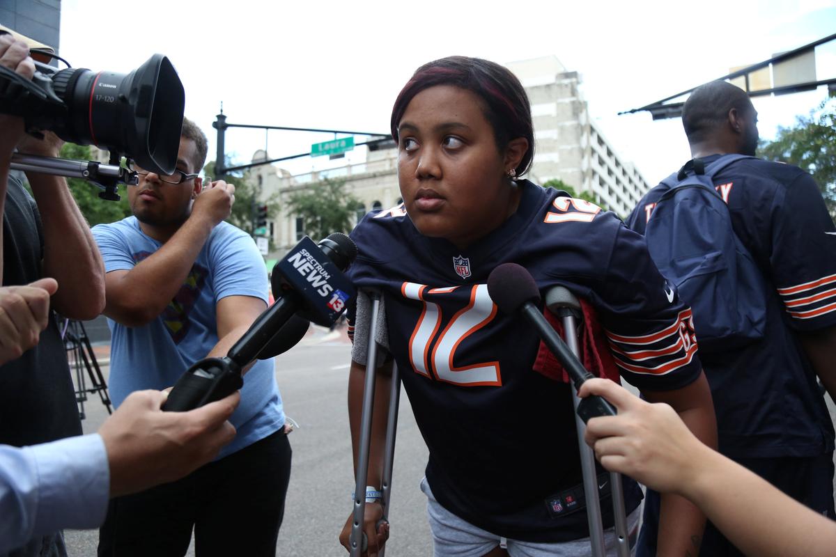 Taylor Poindexter speaks to reporters after witnessing a gunman open fire on gamers participating in a video game tournament outside The Jacksonville Landing in Jacksonville, Florida August 26, 2018. (Reuters/Joey Roulette)