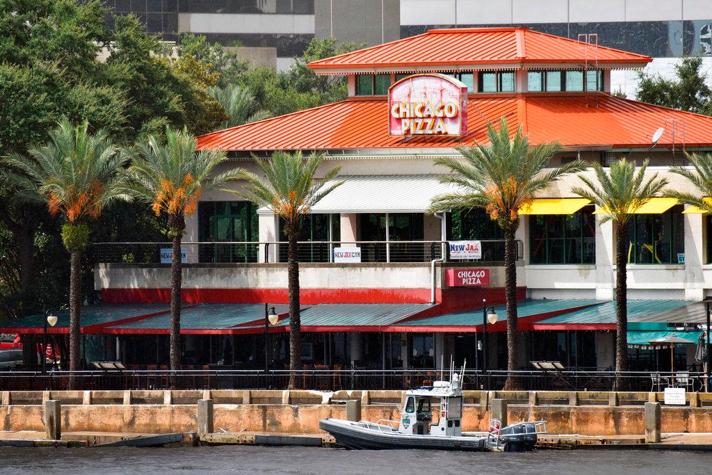 Law enforcement boats patrol the St. Johns River at The Jacksonville Landing after a mass shooting during a video game tournament at the riverfront mall, Sunday, Aug. 26, 2018, in Jacksonville, Fla. (Will Dickey/The Florida Times-Union/AP)