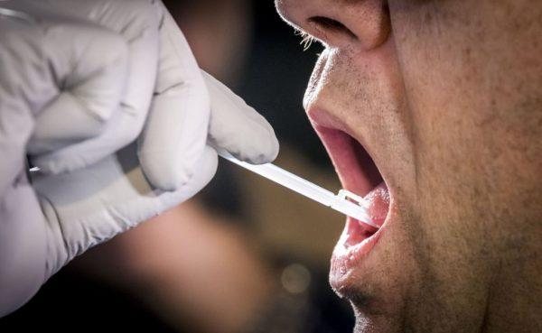 A DNA sample is taken on Aug. 22, 2018, from Landgraaf Mayor Raymond Vlecken during a trial before the launch of a massive DNA search project in the hunt for the killer of 11-year old Nicky Verstappen. (Lex van Lieshout/AFP/Getty Images)