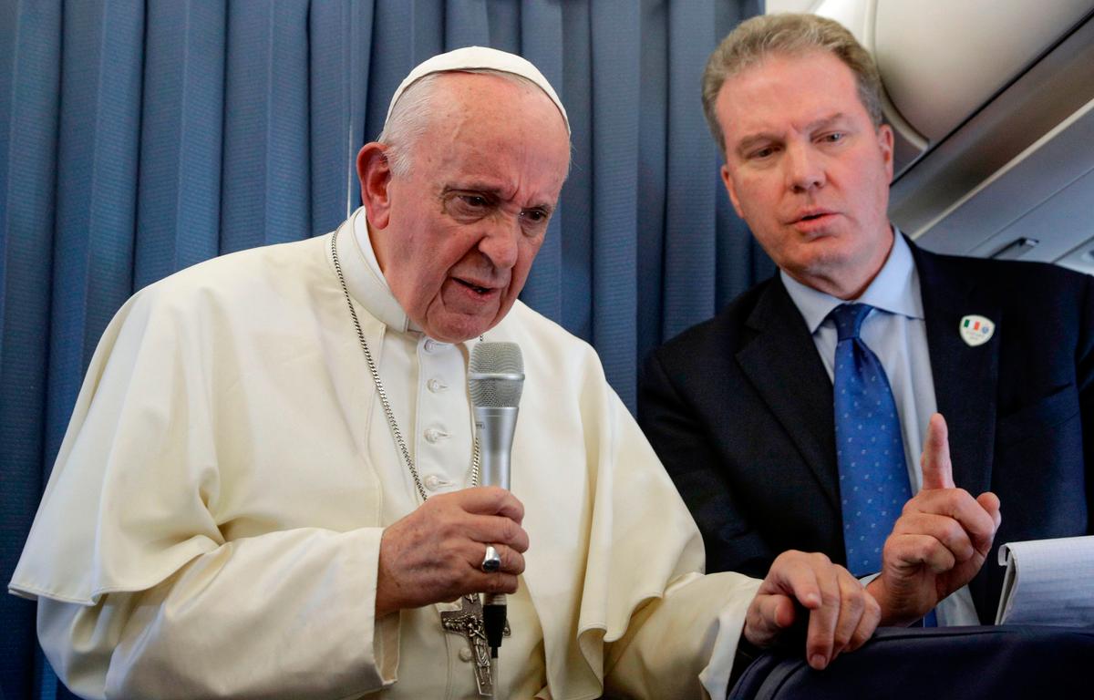 Pope Francis (L), flanked by Head of the Vatican press office, Greg Burke, addresses reporters during a press conference while on a flight between Ireland and Rome at the end of his two-day visit to Ireland on Aug. 26, 2018. (GREGORIO BORGIA/AFP/Getty Images)