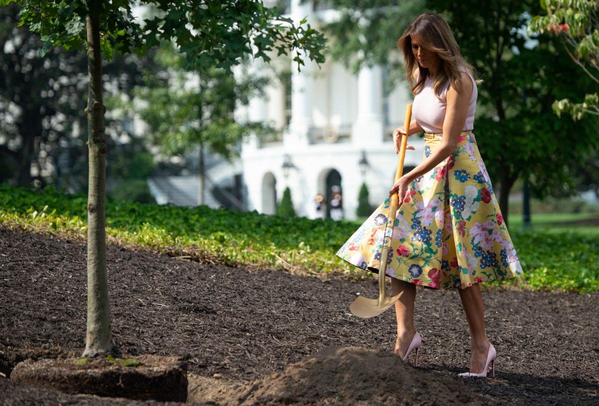 First Lady Melania Trump participates in a tree planting ceremony of a sapling from the original Eisenhower Oak tree that was removed from the grounds last year, on the South Lawn of the White House in Washington on Aug. 27, 2018, (SAUL LOEB/AFP/Getty Images)