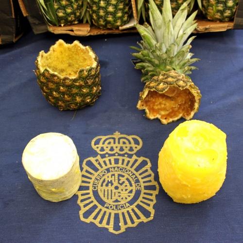 A hollowed-out pineapple with a wax cylinder containing cocaine, seized by Spanish police 26 Aug. 2018 in Madrid. Spain. (Policia National Espana)