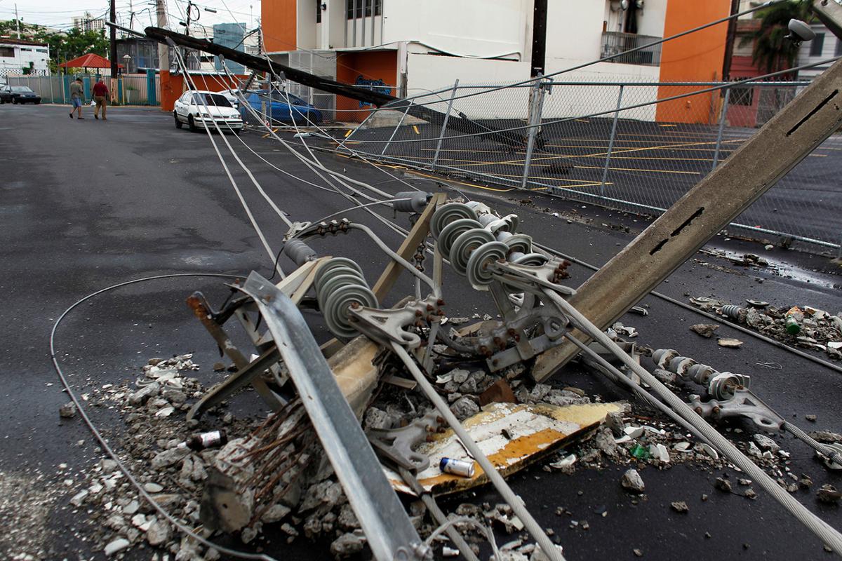 Power line poles downed by the passing of Hurricane Maria lie on a street in San Juan, Puerto Rico, on Nov. 7, 2017. (Ricardo Arduengo/AFP/Getty Images)