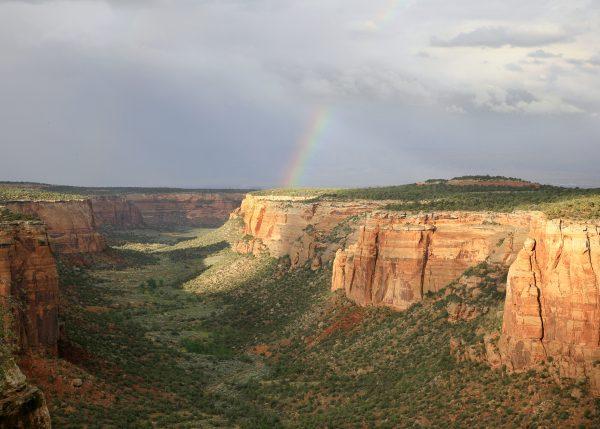 Rainbow above the Monument. (Visit Grand Junction)