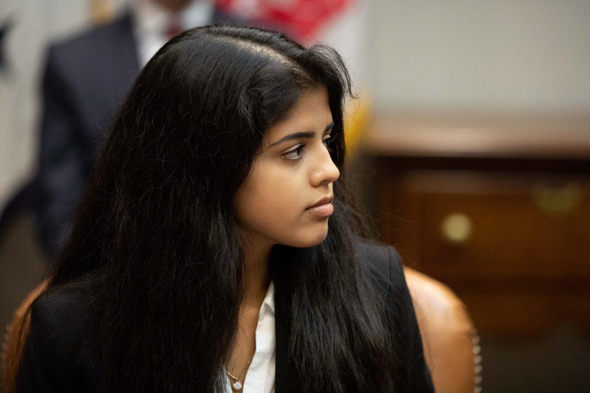 Ananya Pati of the Community Anti-Drug Coalitions of America, listens to President Donald Trump during an announcement on grants for a drug-free communities support program. (Samira Bouaou/The Epoch Times)