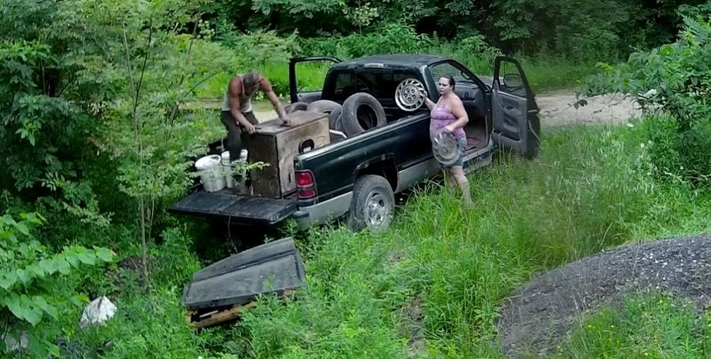 The Sheriff's office in Ohio is searching for a pair of unidentified individuals captured on security cameras illegally disposing of waste in an environmentally protected area. (Screengrab via Hocking County Sheriff's Office)