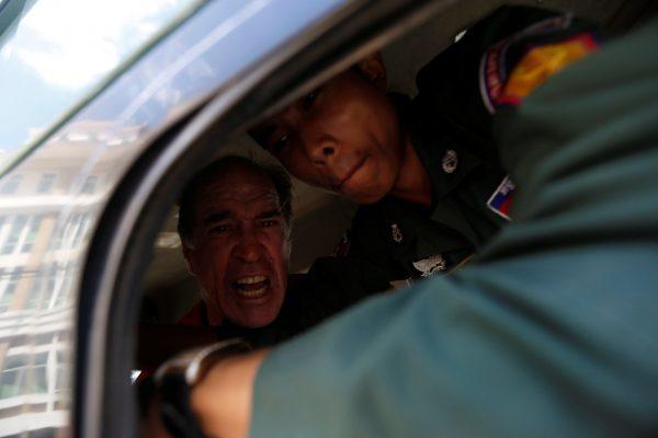 Ricketson shouts inside a prison truck as he leaves the court in Phnom Penh, Cambodia, Aug. 31, 2018. (Samrang Pring/Reuters)