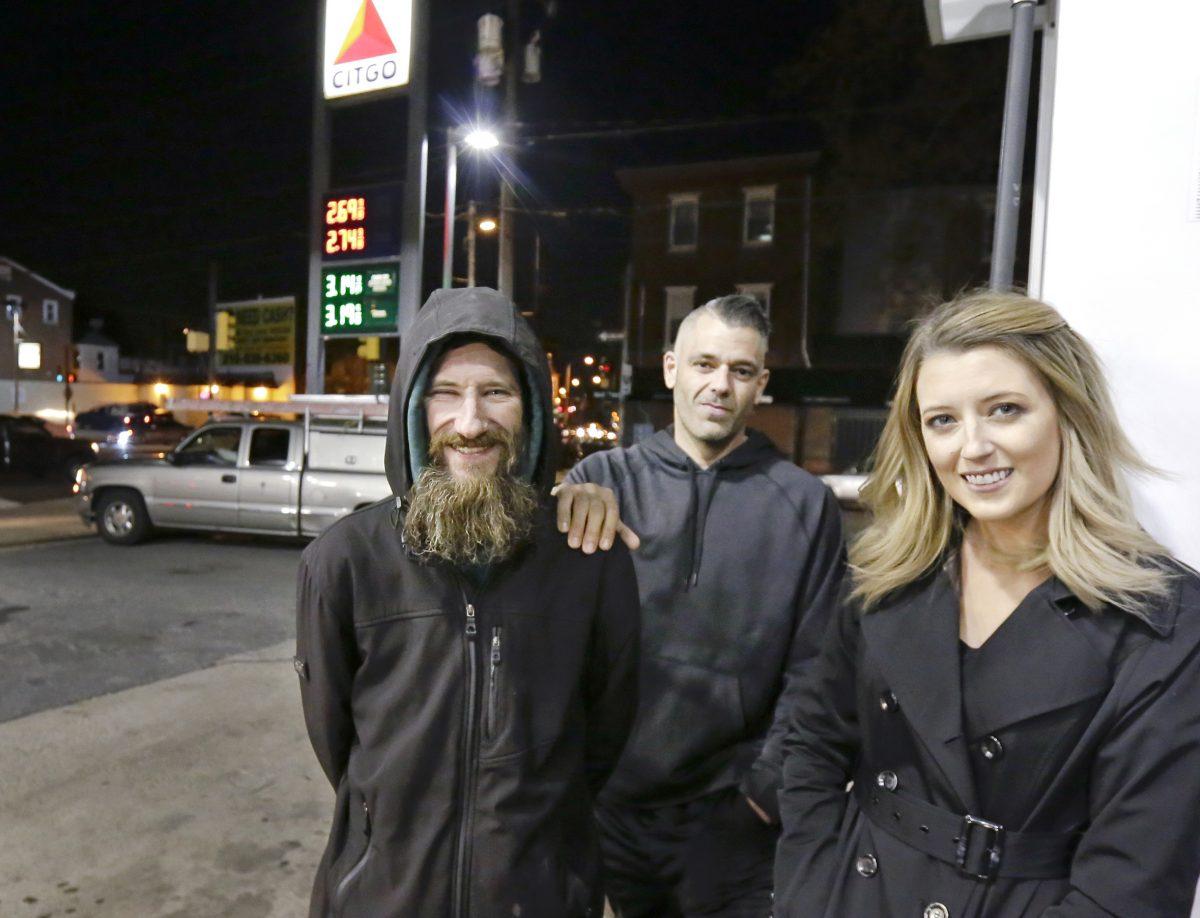(L–R): Johnny Bobbitt, Kate McClure’s boyfriend Mark D’Amico, and Kate McClure pose at a Citgo station in Philadelphia in a file photo. (Elizabeth Robertson/The Philadelphia Inquirer via AP)
