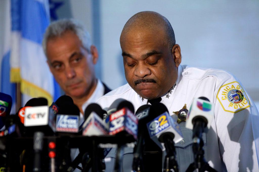 Chicago Mayor Rahm Emanuel listens as Chicago Police Superintendent Eddie Johnson speaks about Chicago's weekend of gun violence during a news conference at the Chicago Police Department 6th District station in Chicago on Aug. 6, 2018. Chicago experienced one of it's most violent weekends of the year, after more than 70 people were shot, with 12 fatalities. (Photo by Joshua Lott/Getty Images)