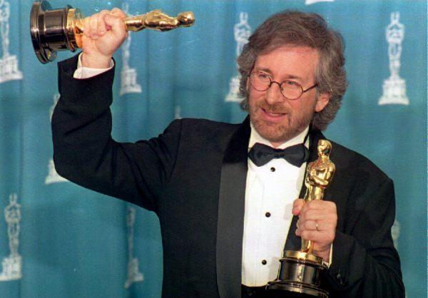 Director Steven Spielberg poses with his two Oscars during the 66th Annual Academy Awards ceremony after winning the awards for best director and best picture for his movie "Schindler's List" in Los Angeles, Calif. on March 21 1994. (DAN GROSHONG/AFP/Getty Images)