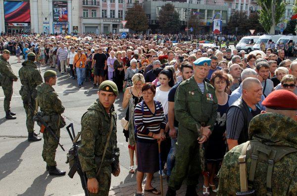 People wait in line to pay their last respects to the leader of the self-proclaimed Donetsk People's Republic Alexander Zakharchenko in Donetsk, Ukraine, Sept. 2, 2018. (Alexander Ermochenko/Reuters)
