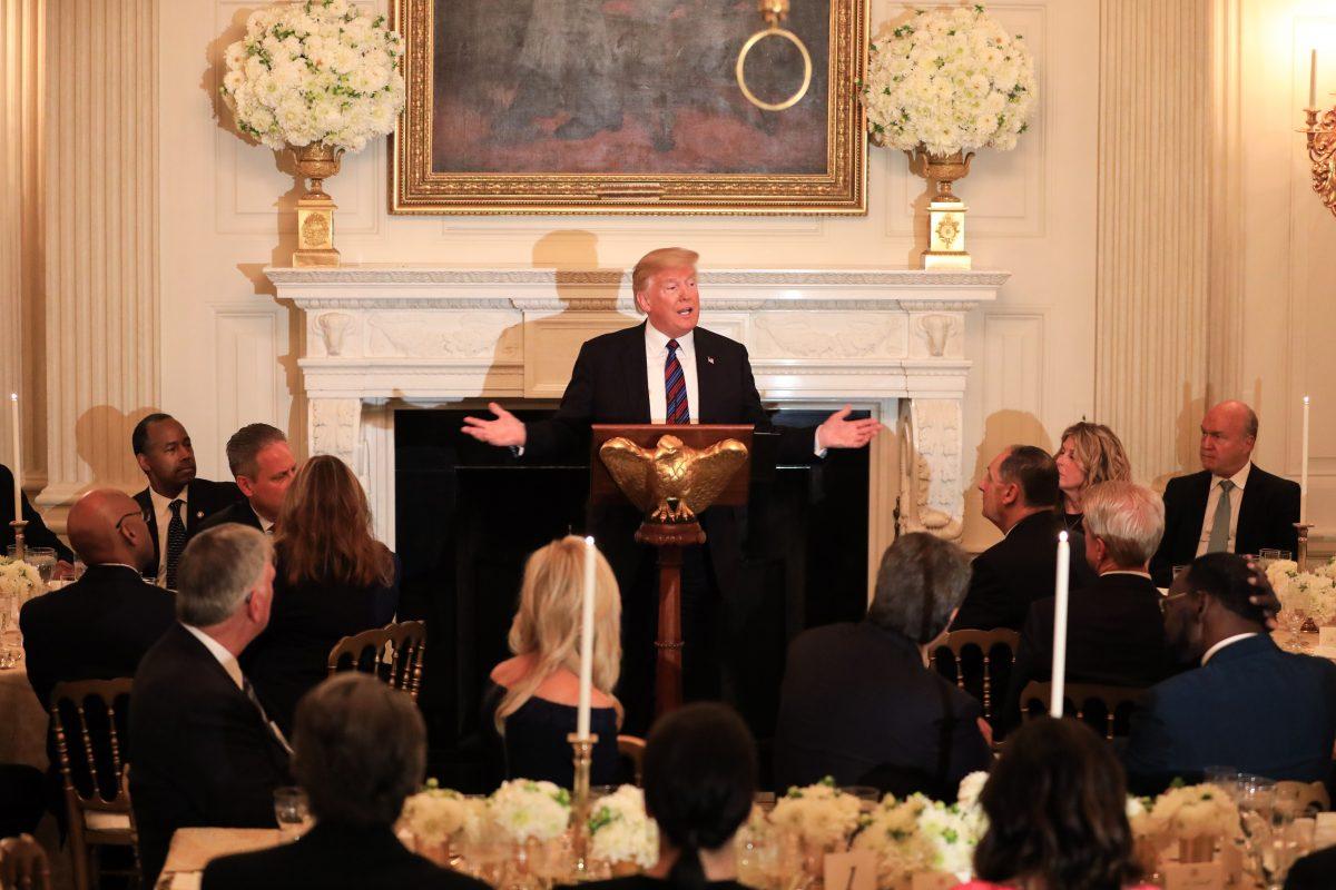 President Donald Trump (C) hosts a dinner celebrating evangelical leadership in the State Dining Room of the White House in Washington on Aug. 27, 2018. (Samira Bouaou/The Epoch Times)