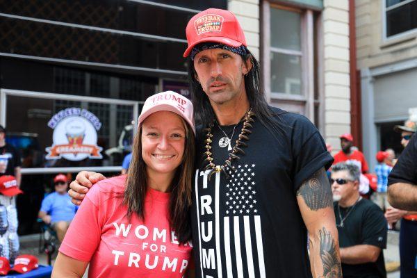 Greg and Hannah Collins line up for President Donald Trump’s Make America Great Again rally in Evansville, Ind., on Aug. 30, 2018. (Charlotte Cuthbertson/The Epoch Times)