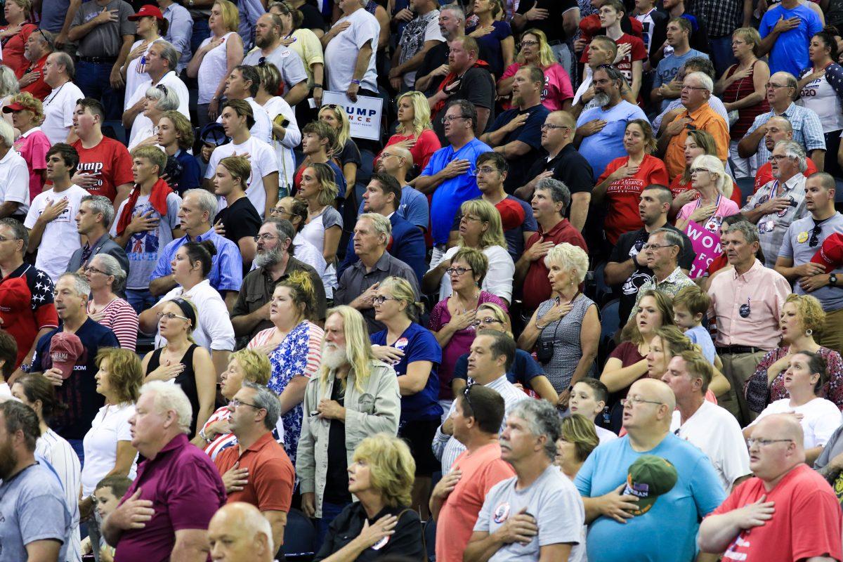 Audience members recite the Pledge of Allegiance at President Donald Trump’s Make America Great Again rally in Evansville, Ind., on Aug. 30, 2018. (Charlotte Cuthbertson/The Epoch Times)