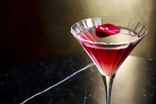 Femme Fatale, with Japanese liqueur sake, French aperitif Byrrh (a sweet vermouth), and a rose petal garnish. (Courtesy of Hotel Café Royal)