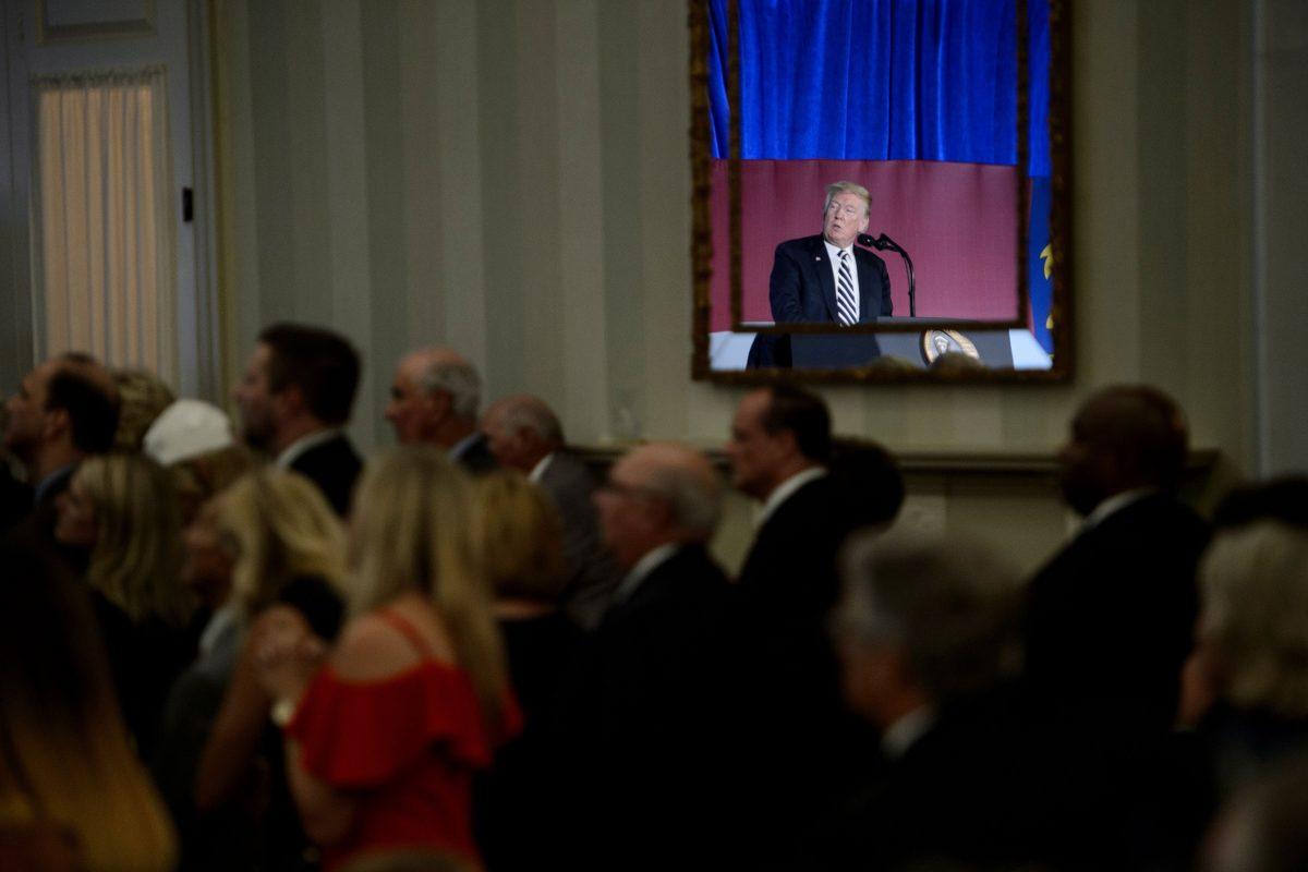 President Donald Trump is reflected in a mirror while speaking at a fundraiser at the Carmel Country Club in Charlotte, N.C., on Aug. 31, 2018. (BRENDAN SMIALOWSKI/AFP/Getty Images)