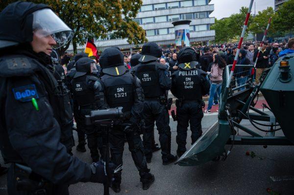 Riot police observe participants in a right-wing march, after it was halted due to a blockade by counter-demonstrators in Chemnitz, Germany, on Sept. 1, 2018. (Jens Schlueter/Getty Images)