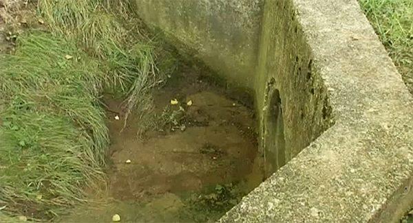 This culvert fills with water in minutes, neighbors say, and anything nearby gets sucked into the pipe. (Screenshot/Fox Network)