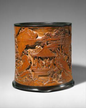 Brush holder by Gu Jue, Qing Dynasty (1644–1911), Kangxi period (1662–1722). Purchase, Eileen W. Bamberger Bequest, in memory of her husband, Max Bamberger, 1994. This bamboo brush holder depicts scenes from the famous poem “Ode to the Pavilion of the Inebriated Old Man” by Ouyang Xiu, who was demoted in 1045 to the remote Anhui Province where he took solace in wine and nature. (The Metropolitan Museum of Art)