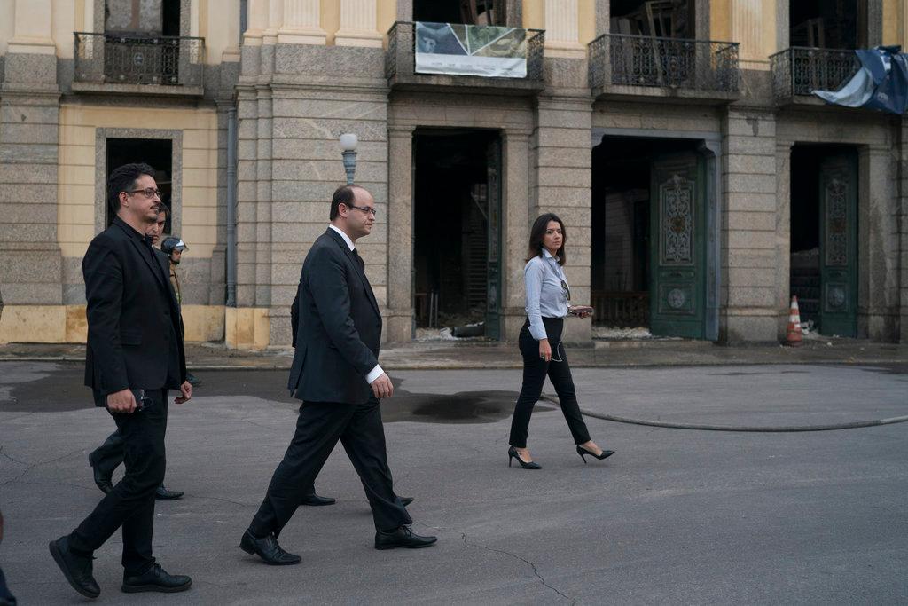Minister of education Rossieli Soares, center, and the minister of the culture Sergio Sa Leitao, left, arrive at the National Museum after an overnight fire in Rio de Janeiro, Brazil, Monday, Sept. 3, 2018. (AP/Leo Correa)