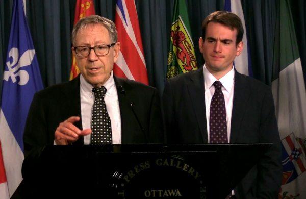 Irwin Cotler (L), chair of the Raoul Wallenberg Centre for Human Rights, speaks at a press conference on Parliament Hill in Ottawa on Aug. 30, 2018. With him is Brandon Silver, the director of policy and projects at the centre, which Cotler founded in 2015. (Limin Zhou/The Epoch Times)