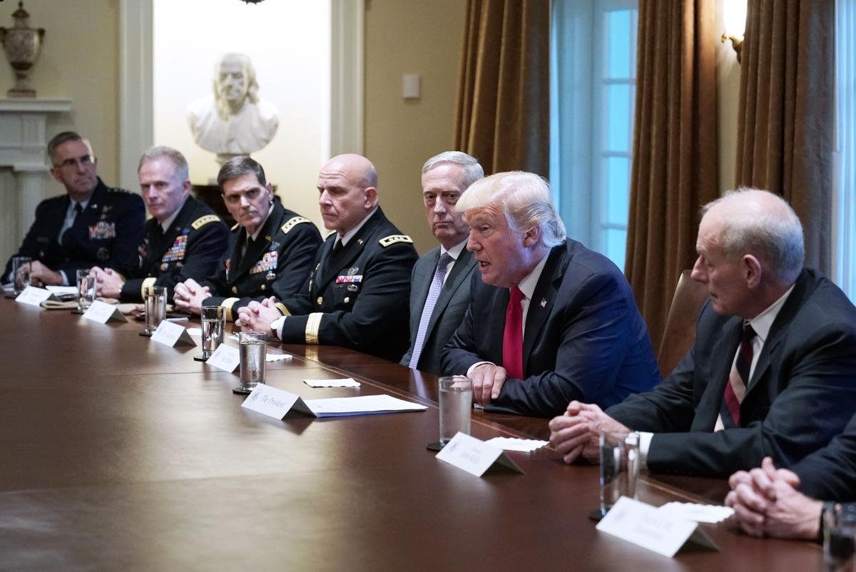 President Donald Trump, flanked by Defense Secretary James Mattis (L), and Chief of Staff John Kelly (R), meets with senior military leaders in the Cabinet Room of the White House on Oct. 5, 2017. (MANDEL NGAN/AFP/Getty Images)