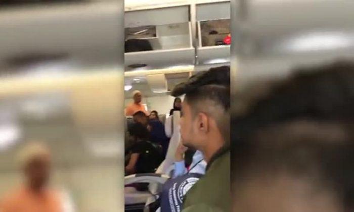 Passenger Shares Video Footage of Inside Emirates Plane With Sick Passengers