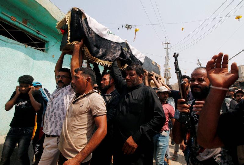 Mourners carry the coffin of a protester, who was killed in clashes with security forces in Basra, Iraq September 4, 2018. (Reuters/Essam al-Sudani)