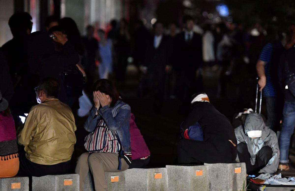 People react during blackout after a powerful earthquake hit the area in Sapporo, Japan, Sept. 6, 2018. (Kyodo/Reuters)