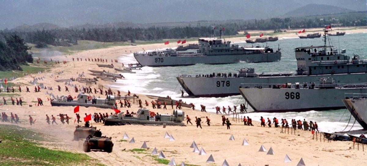 People's Liberation Army troops storm ashore from landing craft in an exercise on the mainland coast close to Taiwan, on Sept. 10, 1999. (STR/AFP/Getty Images)