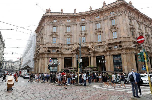 People in front of the entrance of Starbucks Reserve Roastery during the opening day in downtown Milan, Italy, Sept. 7, 2018. (Reuters/Stefano Rellandini)