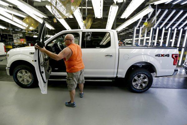 Under pressure from U.S. safety regulators, Ford is recalling about 2 million F-150 pickups in North America because the seat belts can cause fires. The recall covers certain trucks from the 2015 through 2018 model years. (AP Photo/Charlie Riedel, File)