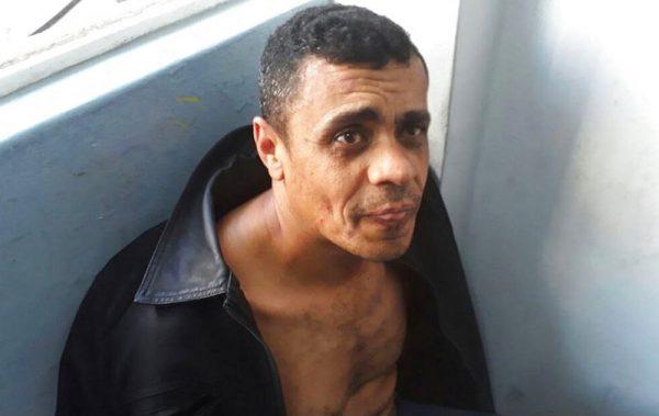 Adelio Bispo de Oliveira, suspected of stabbing Jair Bolsonaro, a leading Brazilian presidential candidate, sits after being detained in Juiz de Fora, Brazil, on Sept. 6, 2018. (Military Police/AP)