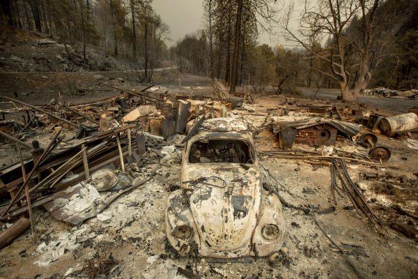 A scorched VW Beetle rests in a clearing after the Delta Fire burned through the Lamoine community in the Shasta-Trinity National Forest, Calif., on Sept. 6, 2018. (AP Photo/Noah Berger)