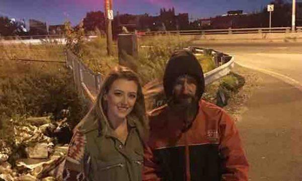 Kate McClure and John Bobbitt stand near the spot by I-95 where he helped her when she ran out of gas. (GoFundMe)