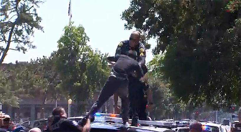 Police eventually stopped negotiating and tackled Lopez. (CNN screenshot)