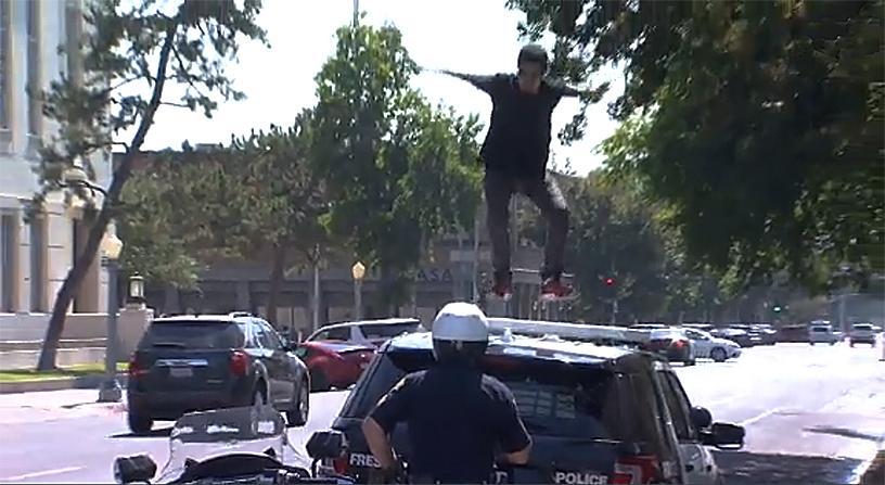 Lopez began jumping and stomping on the windshield, lights, and roof of the patrol car. (CNN screenshot)