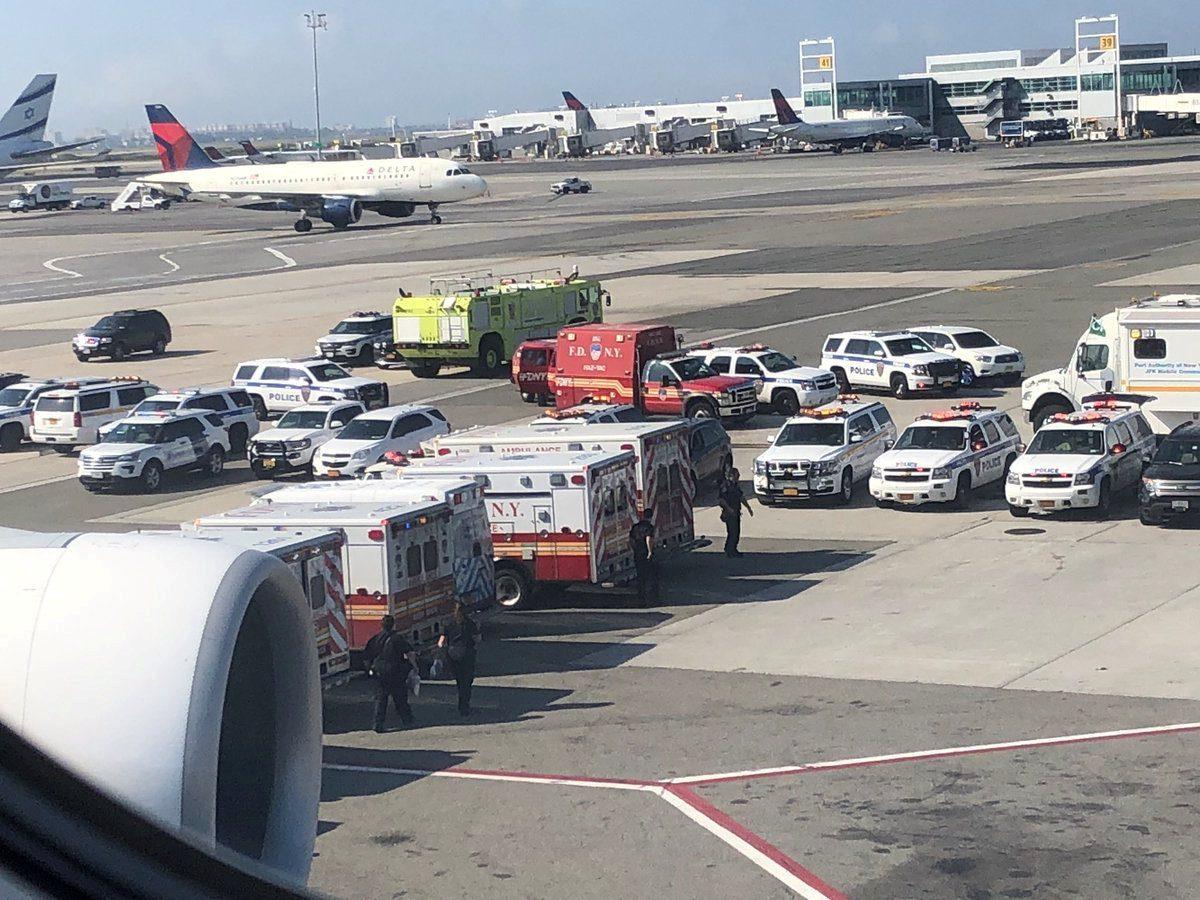 Emergency services are seen after passengers fell ill on a flight from New York to Dubai, at JFK Airport, New York, on Sept. 05, 2018. (Larry Coben/via Reuters)