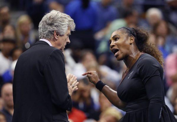 Serena Williams (R), talks with referee Brian Earley during the women's final of the U.S. Open tennis tournament against Naomi Osaka, of Japan, on Sept. 8, 2018, in New York. (AP Photo/Adam Hunger)