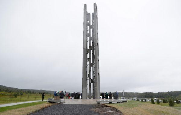 People attending the dedication stand around the 93-foot tall Tower of Voices on Sept. 9, 2018 at the Flight 93 National Memorial in Shanksville, Pa. (AP Photo/Keith Srakocic, Pool)