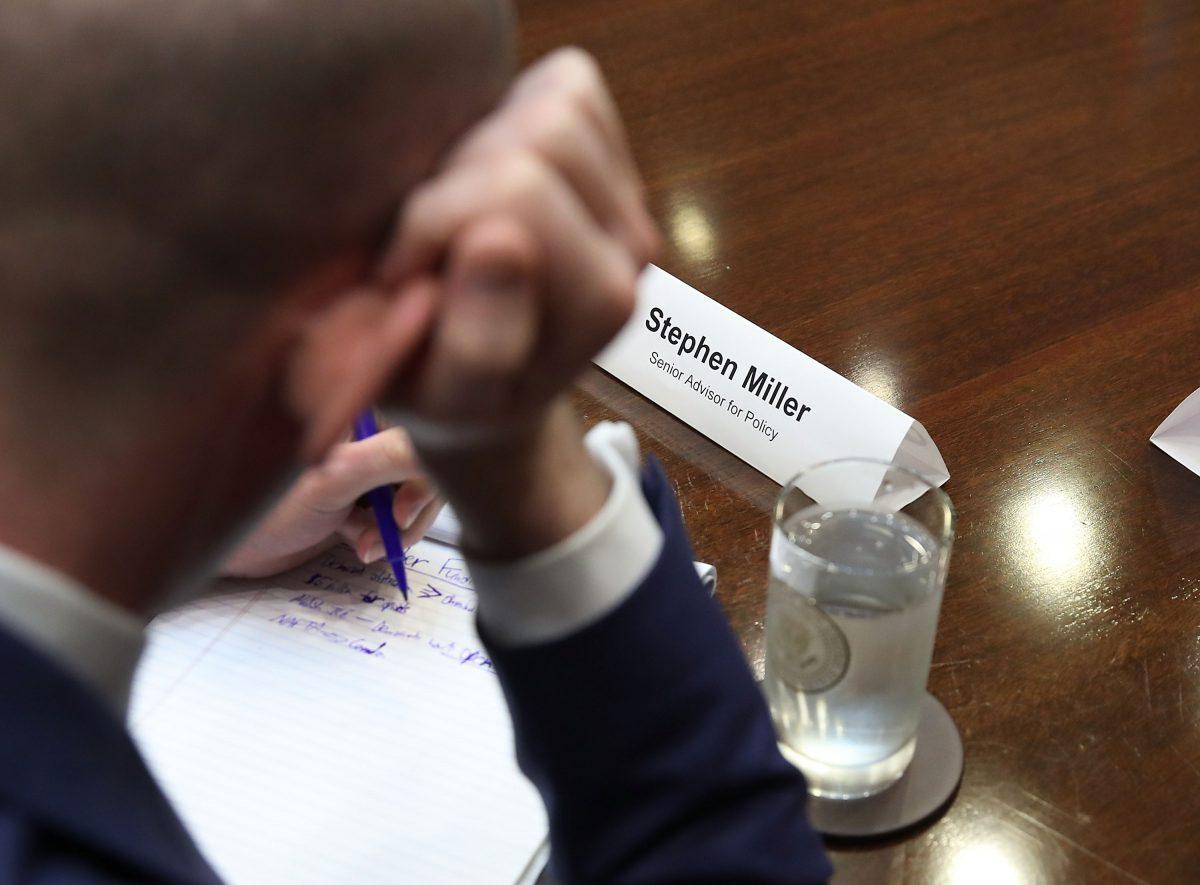 White House advisor Stephen Miller writes on a note pad during a meeting with President Donald Trump in the Roosevelt Room of the White House on Sept. 5, 2018. (Mark Wilson/Getty Images)